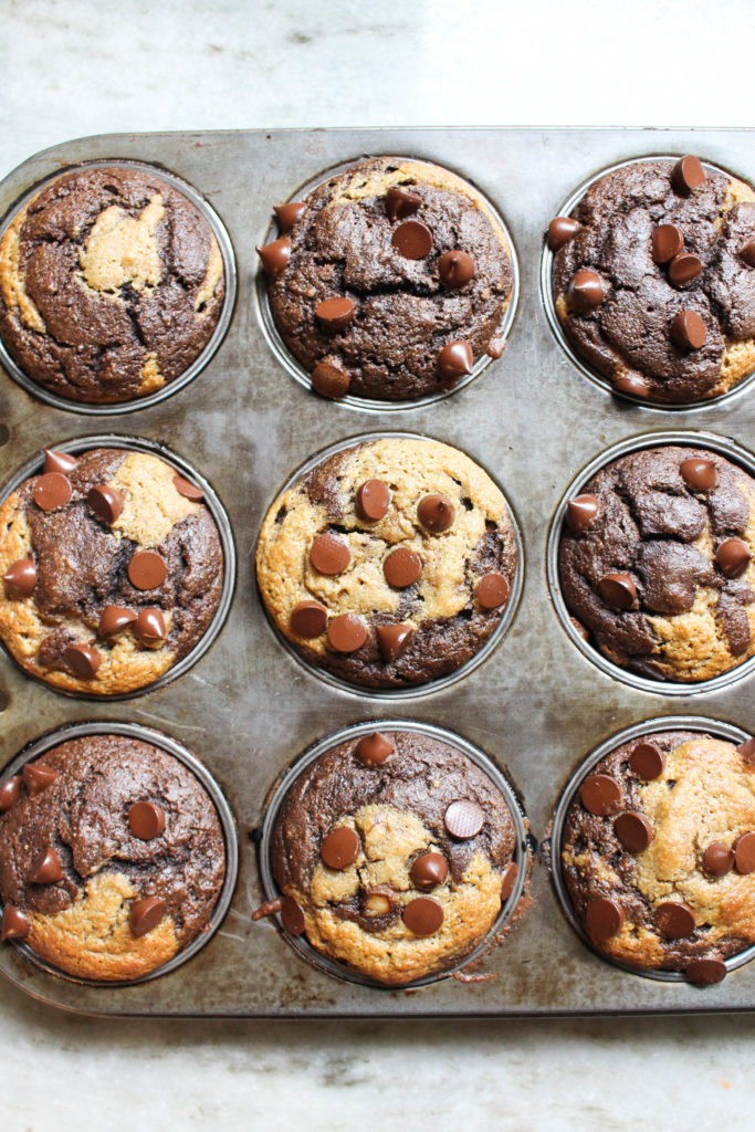 Chocolate twist banana bread muffins in muffin pan.