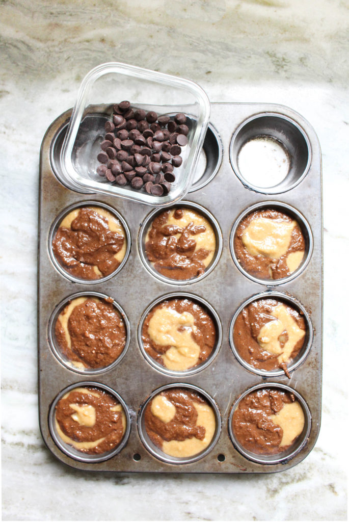 muffin tins with batter inside right before baking.