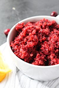 Side angle of easy cranberry relish in a beautiful white bowl.
