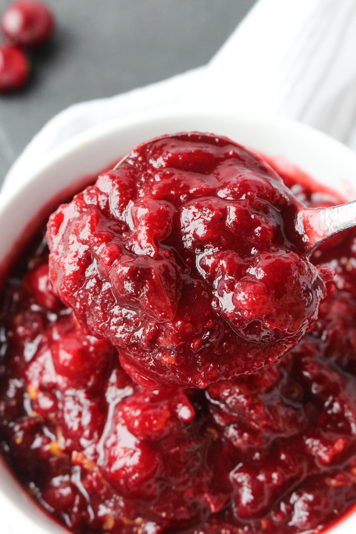 Large spoonful of homemade paleo cranberry sauce.