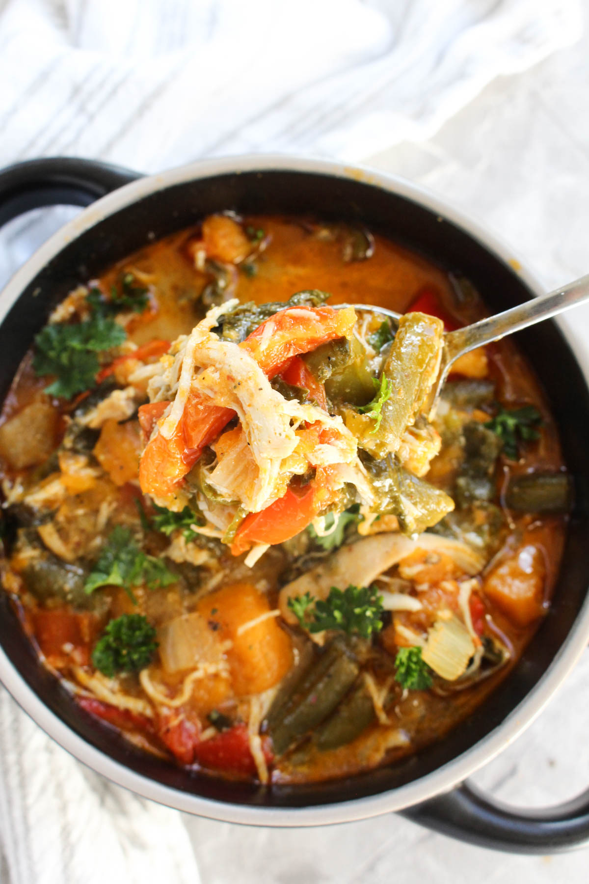 Large spoonful of Thai Red Curry Chicken Soup.