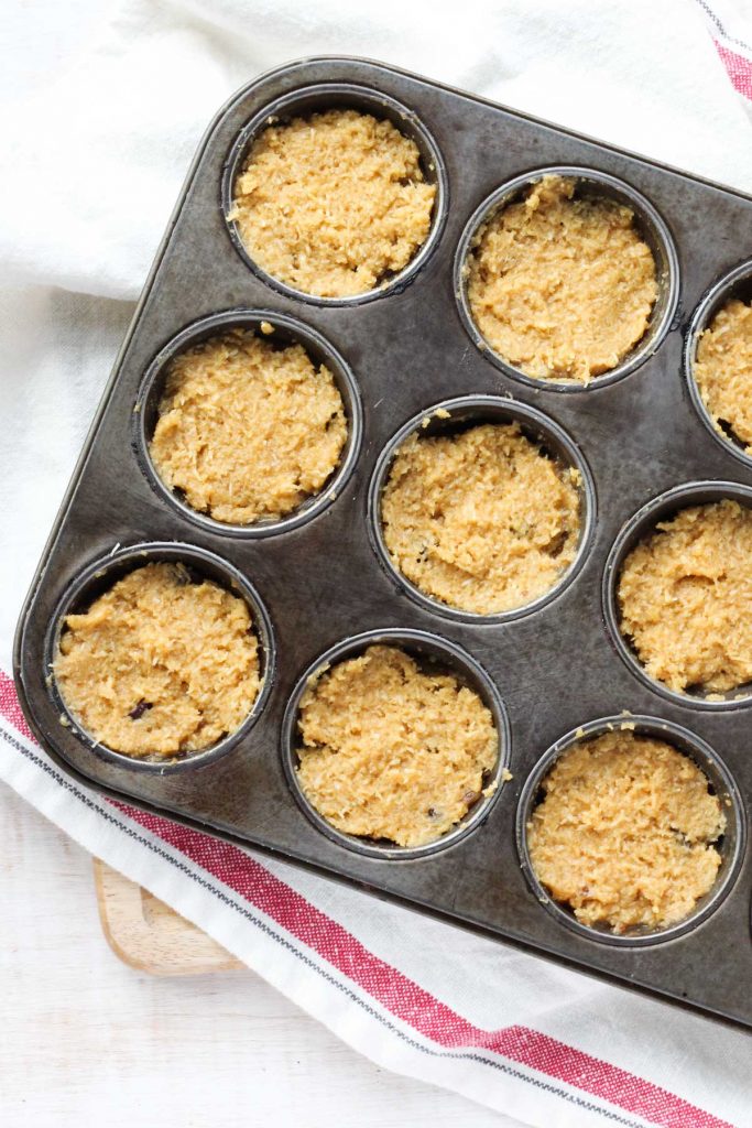 samoa muffins with the first two layers in the pan.