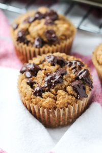Sweet potato muffin with melted chocolate chips on top.