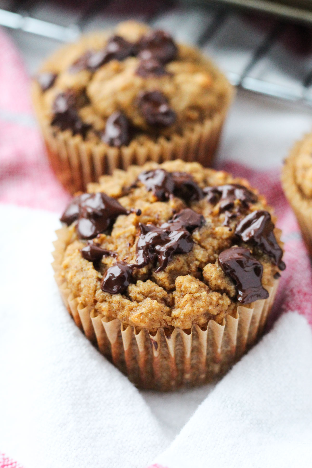 Sweet potato muffin with melted chocolate chips on top.