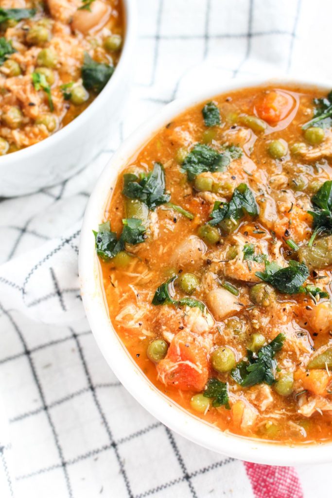 Bright and beautiful bowl of instant pot minestrone soup with fresh parsley on top.