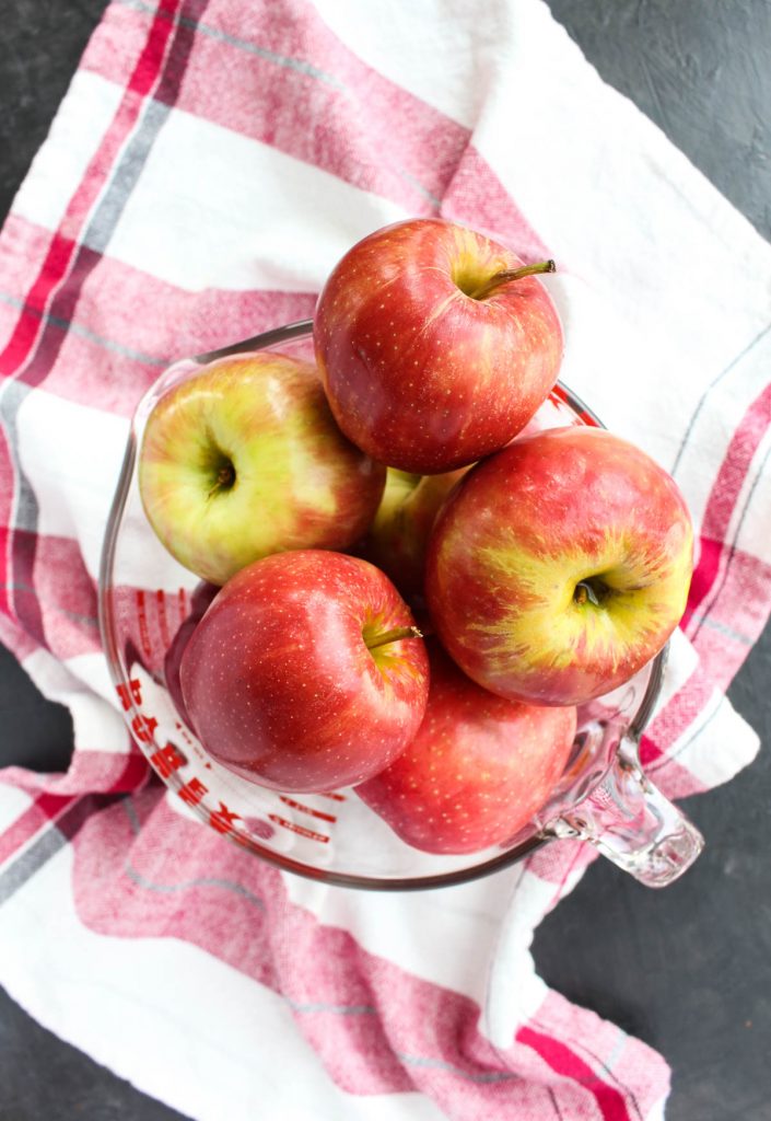 Apples in a glass bowl.