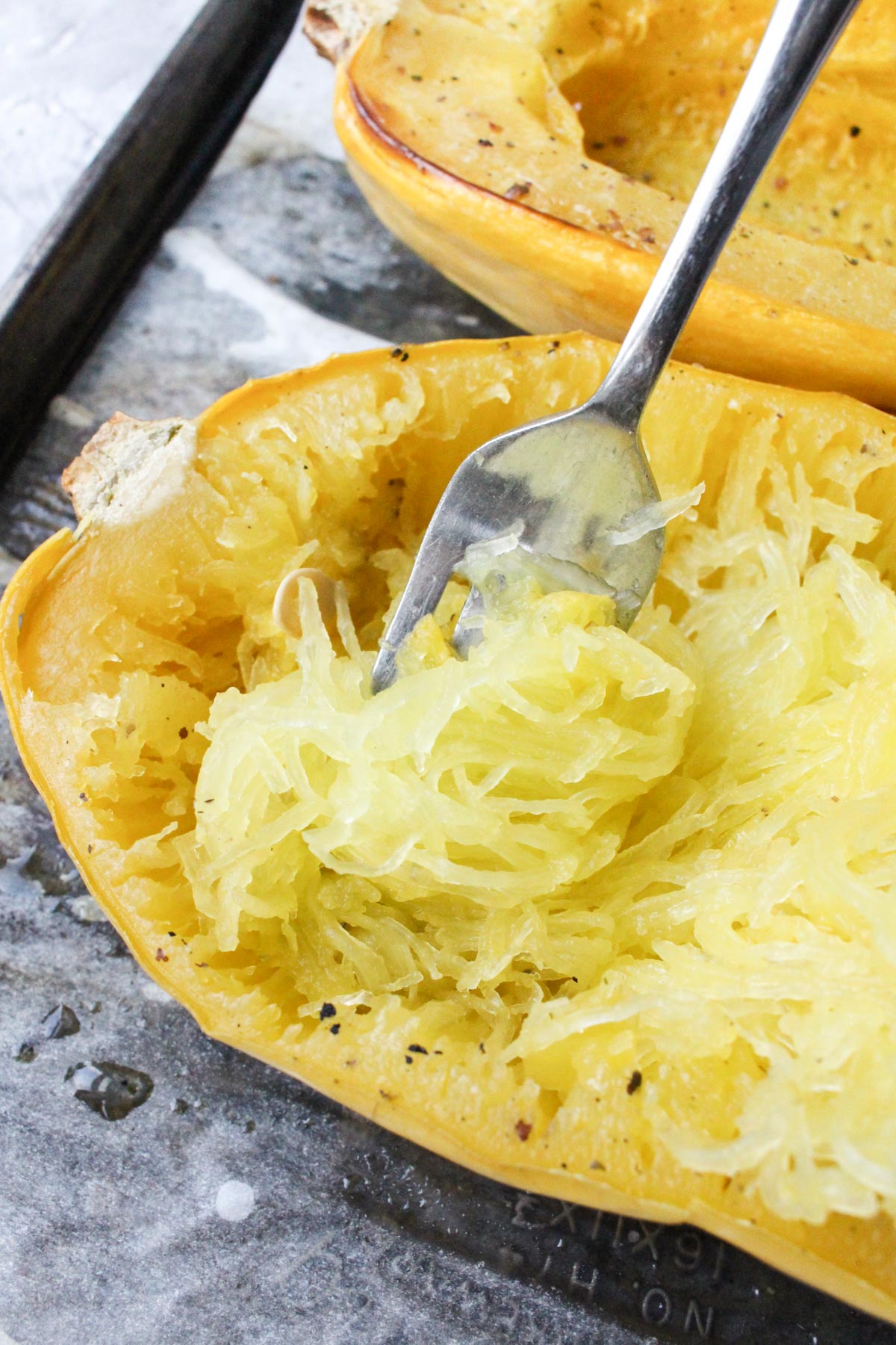 Fork with a large bite of spaghetti squash.