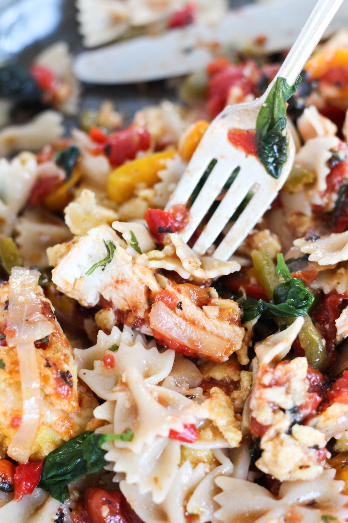 Close up of chicken bite on a fork.