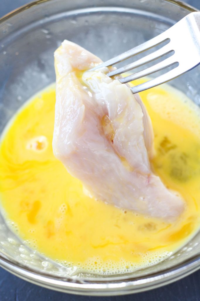 Chicken in egg wash.