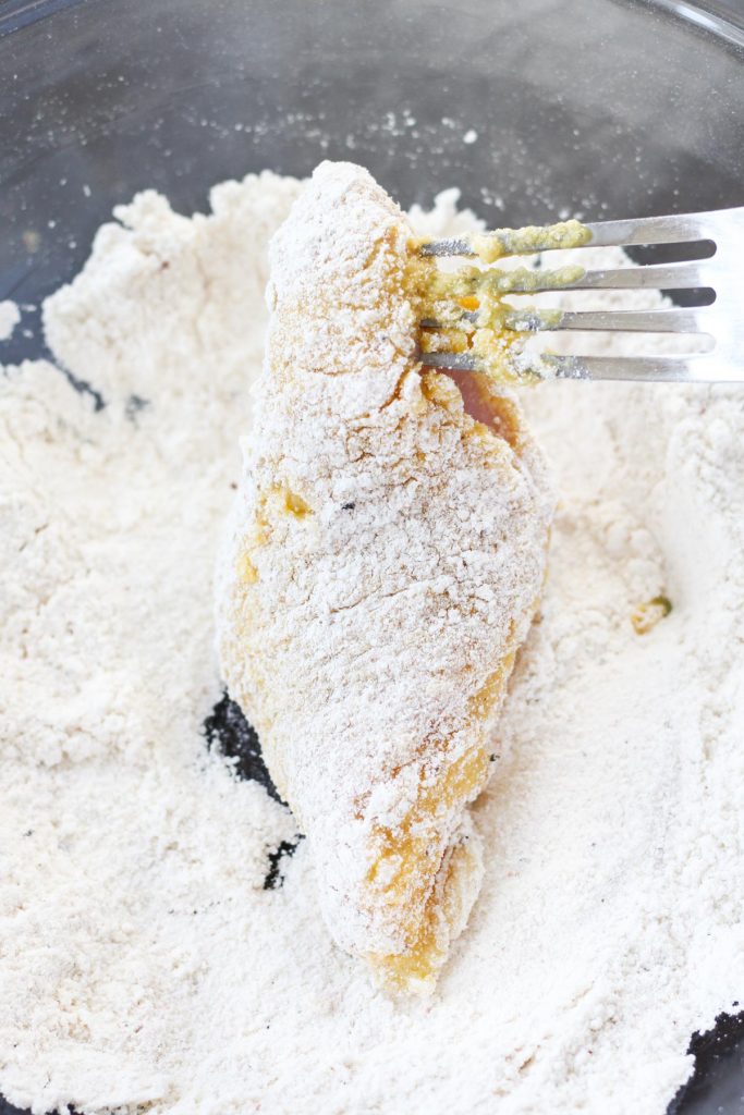 Chicken in final coating of flour.