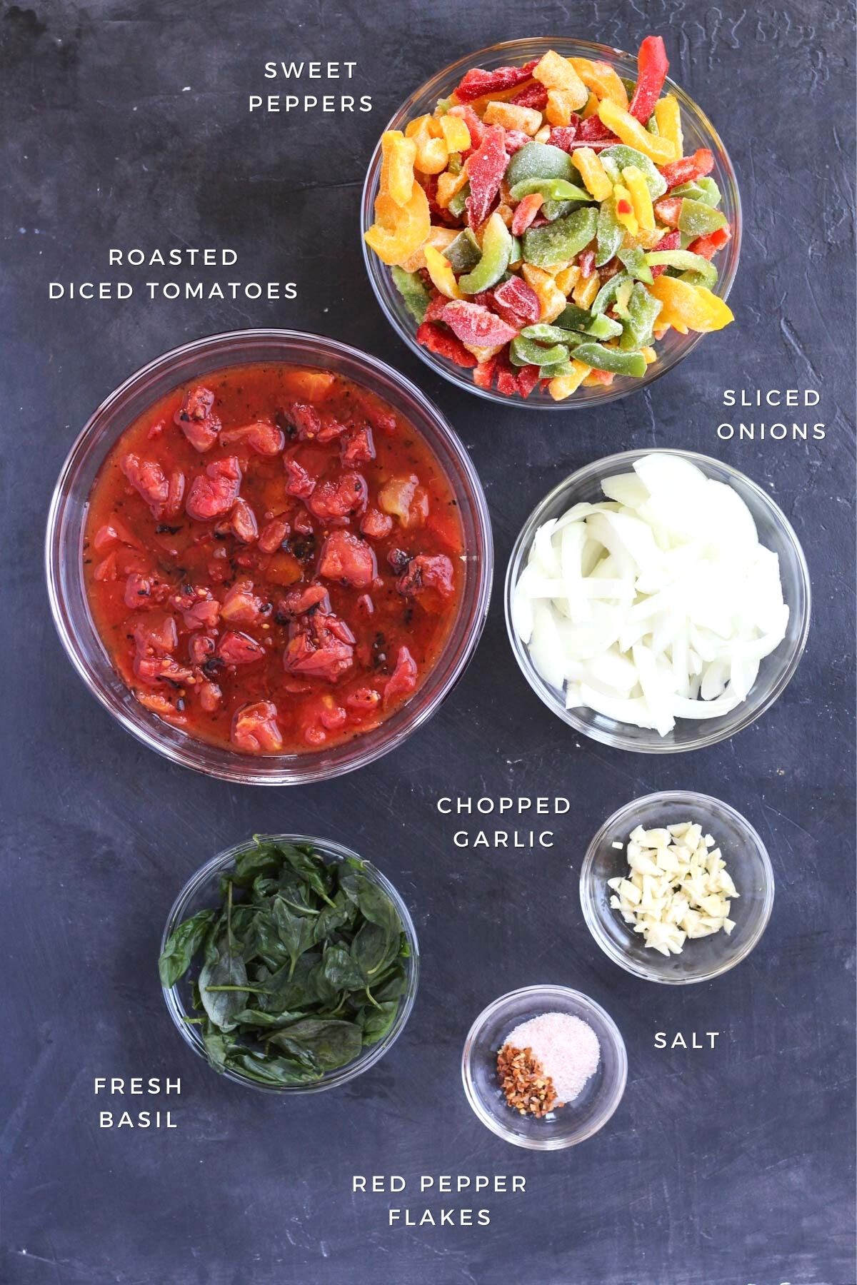 Ingredients measured out for chicken cacciatore.