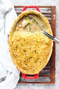 Overhead shot of chicken pot pie with half scooped out.