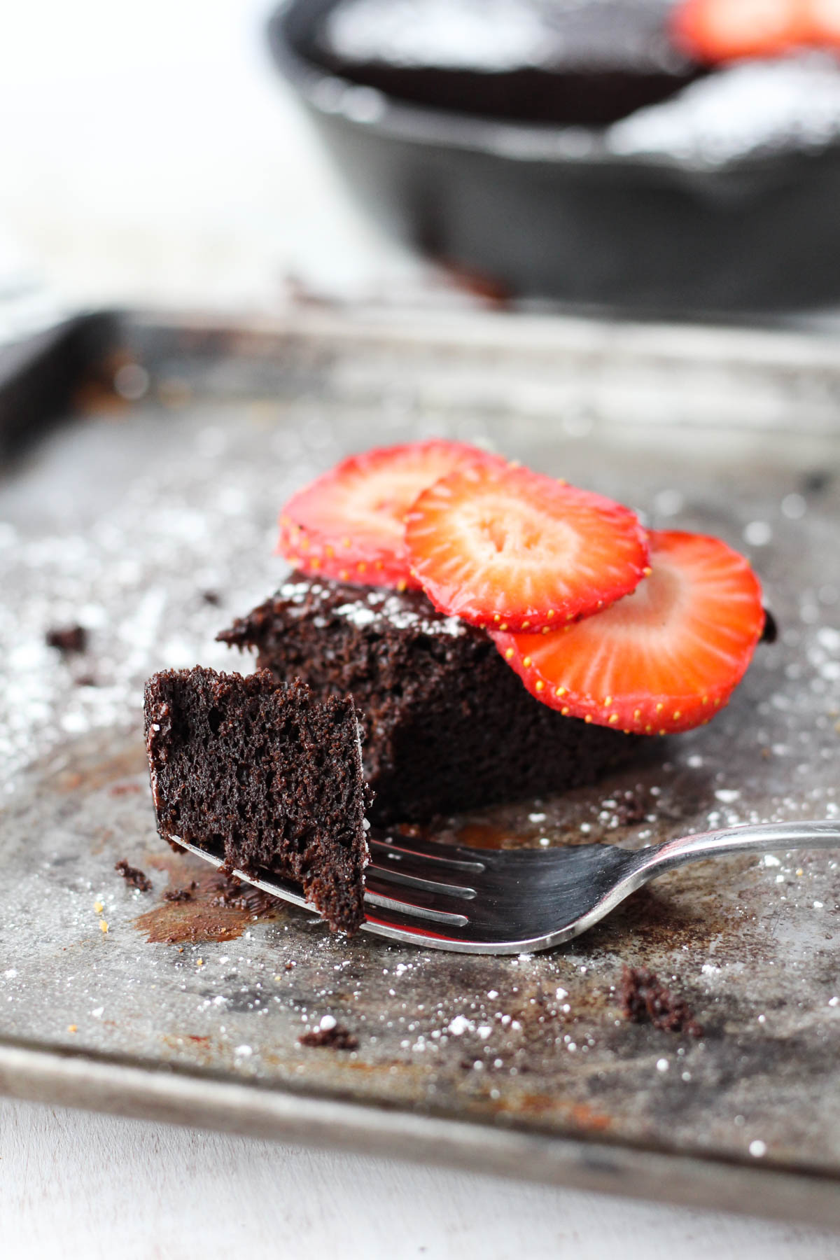 Fork with a bite of chocolate cake.