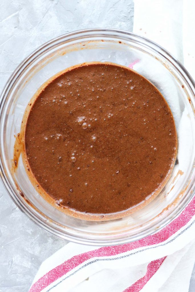 Cake batter in a glass mixing bowl.