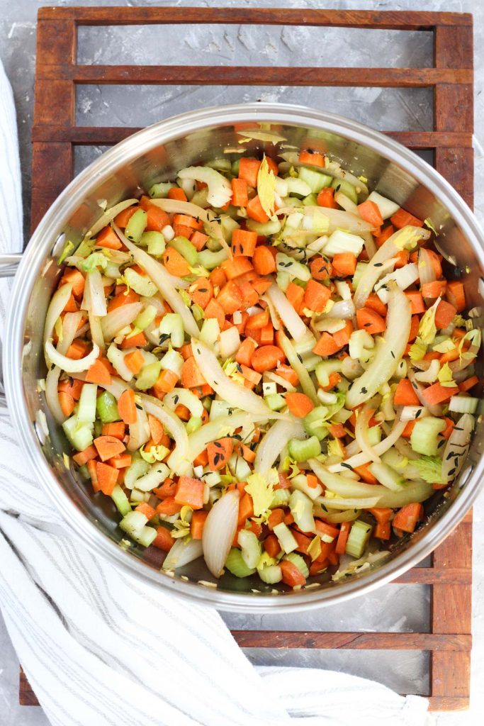 Onions, garlic, celery, and carrots in the pot.