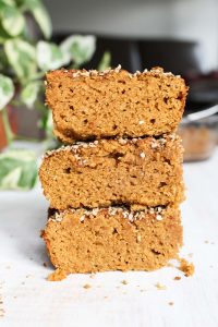 Pumpkin spice cake slices stacked on top of each other.