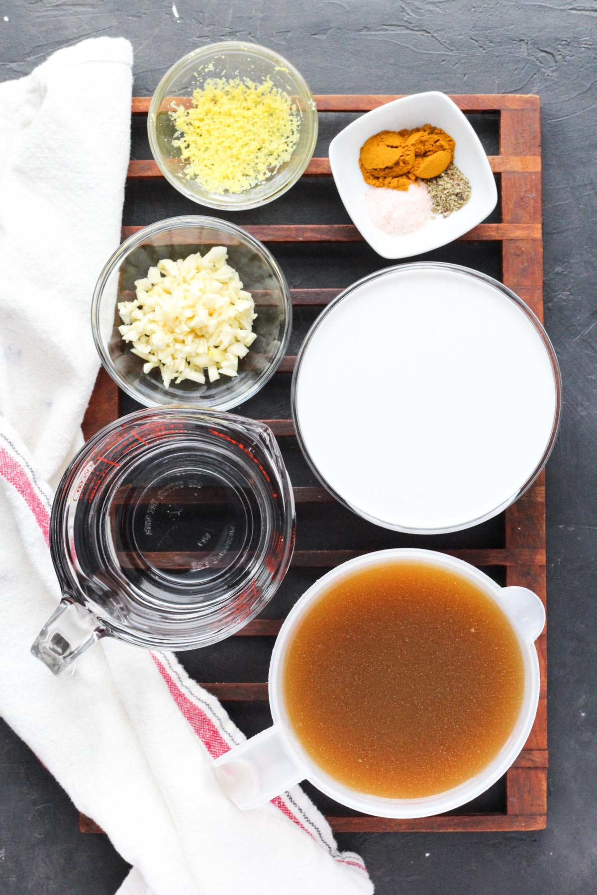Overhead shot broth and seasonings measured out.