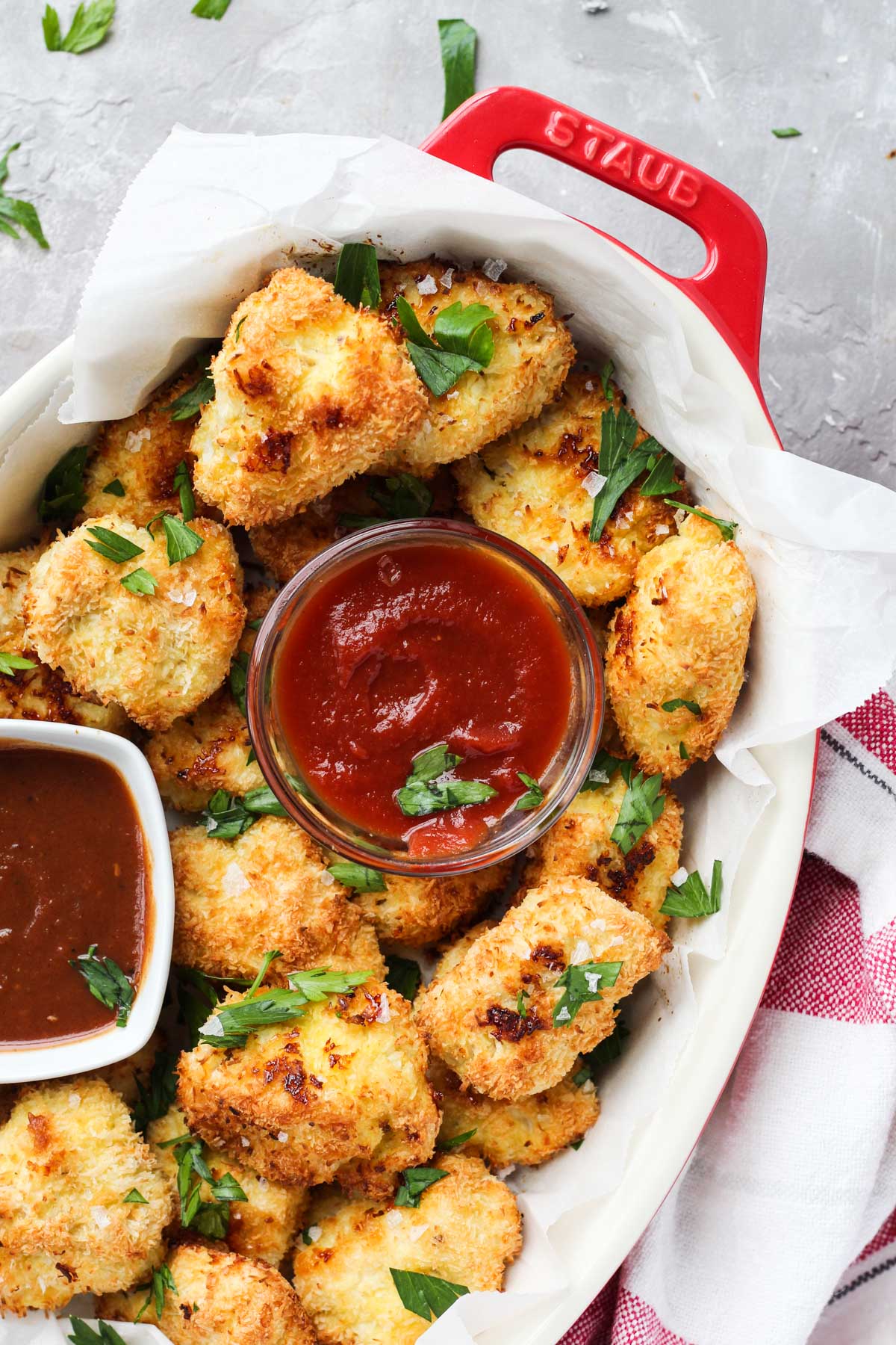Overhead shot of chicken nuggets with ketchup and bbq sauce.