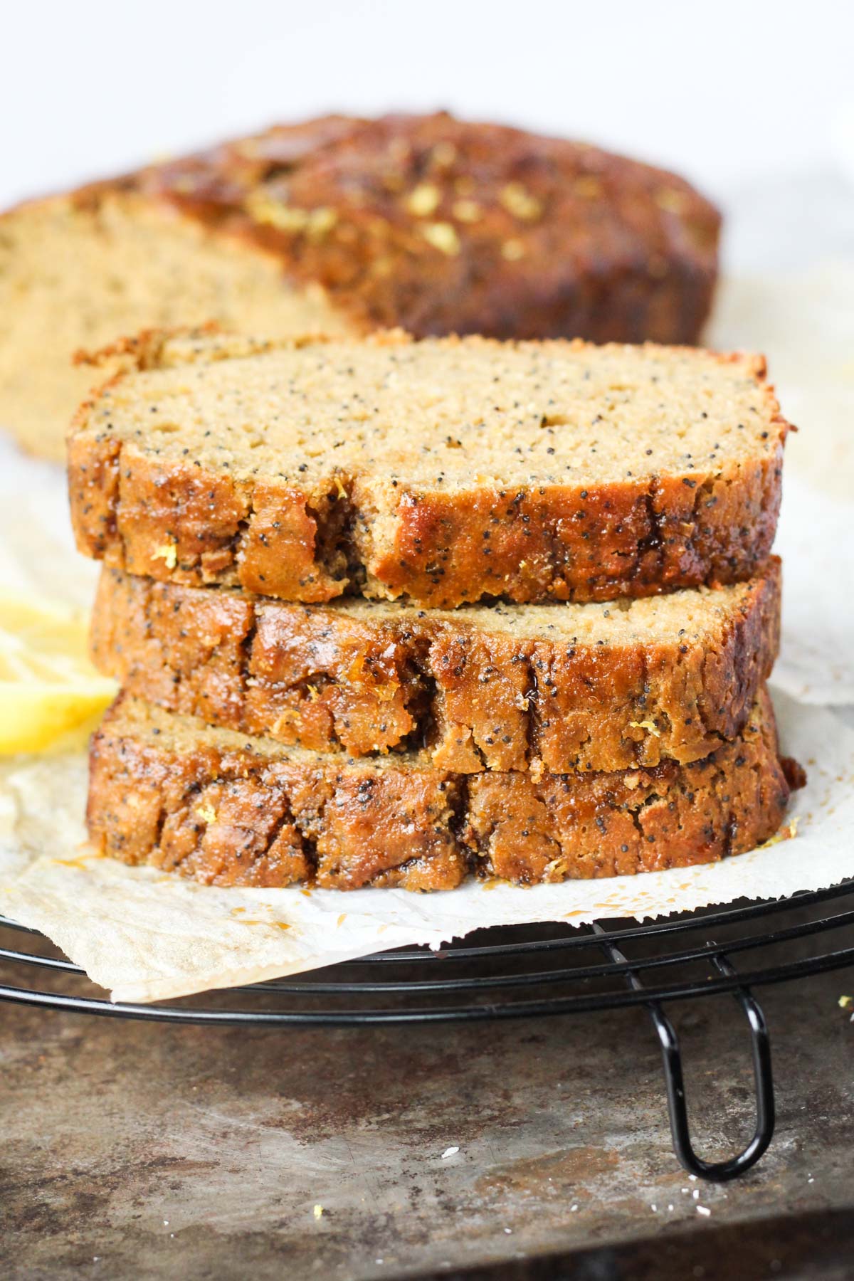 Front shot of lemon bread slices stacked on top of each other.