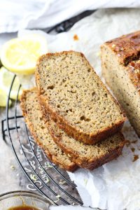 Slices of lemon poppy seed bread stacked on top of each other.