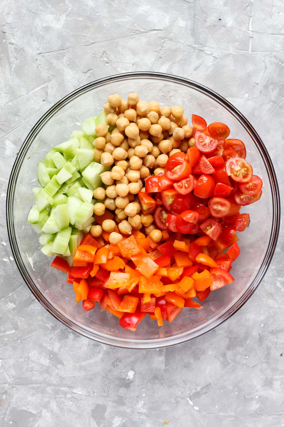 Vegetables and beans in mixing bowl.