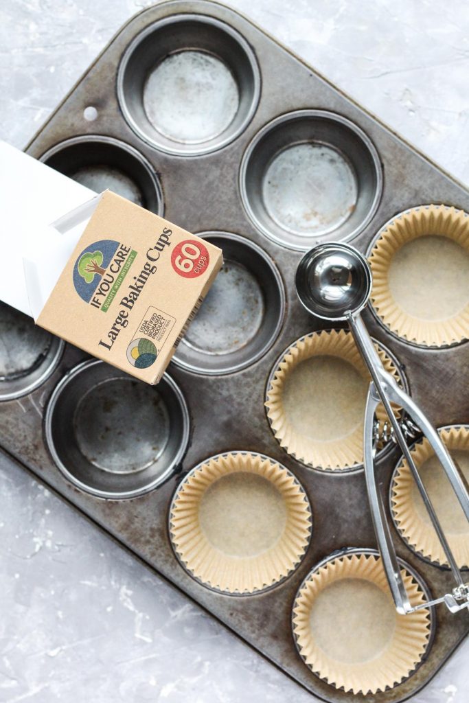 Overhead shot of muffin pan with parchment paper liners.