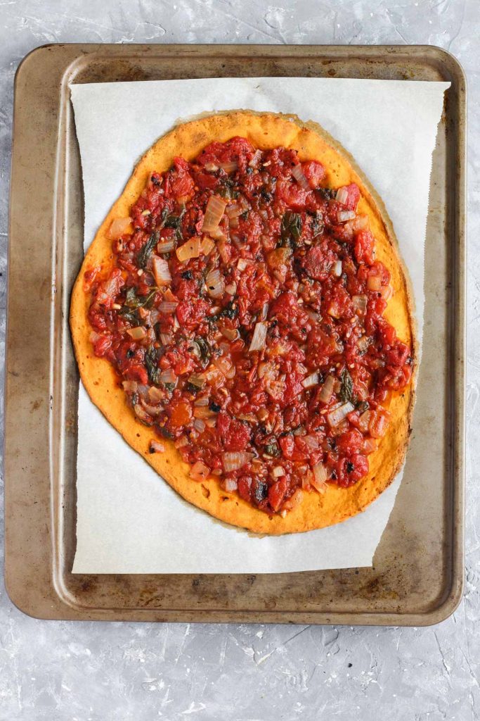 Pizza with sauce on top.