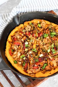 Finished pizza in cast iron skillet.