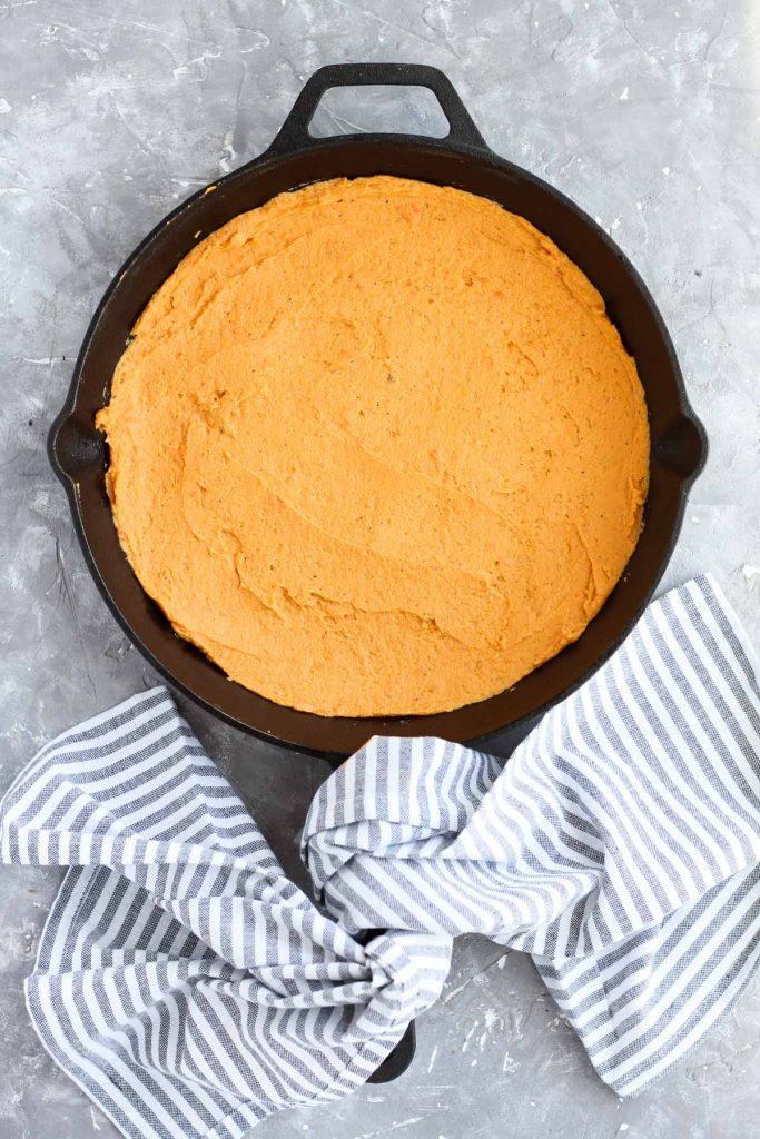 Dough Pressed into cast iron skillet.