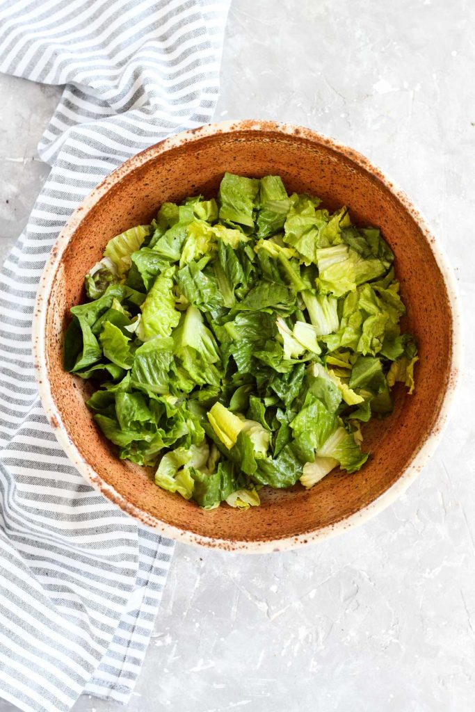Lettuce in large salad bowl.