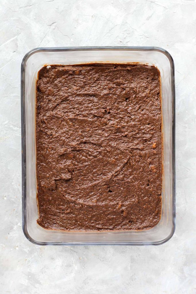 Brownies in glass baking dish before going in the oven.