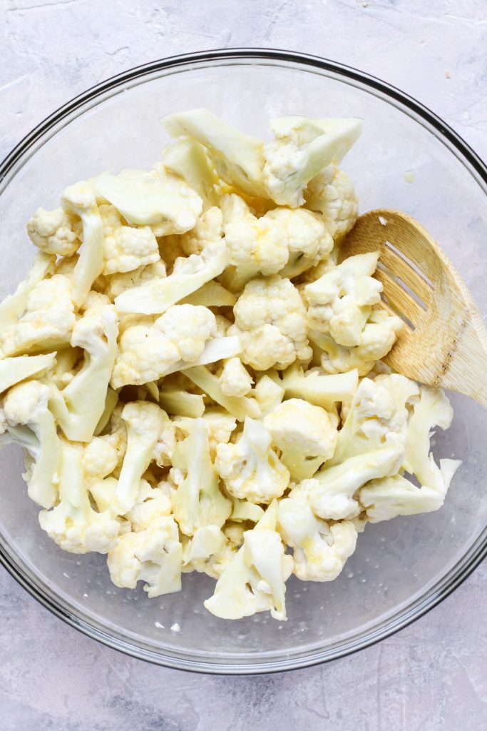 Eggs mixed into cauliflower florets.