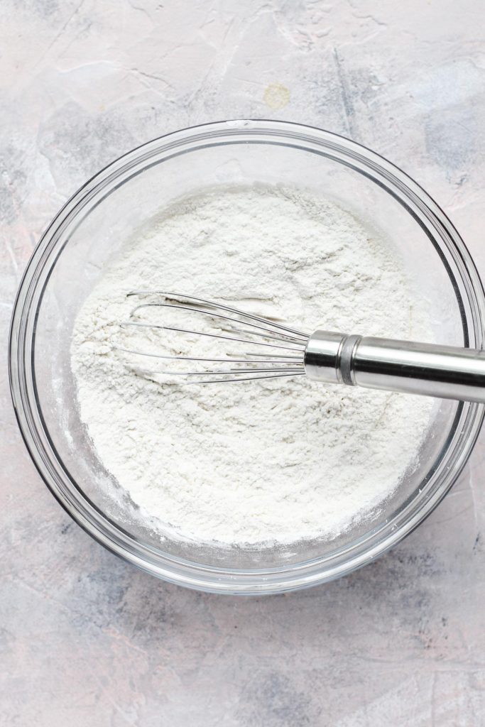 Flour being mixed with whisk.