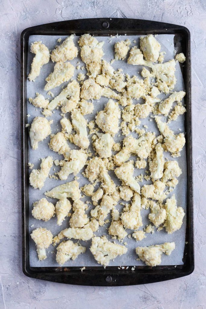 Cauliflower bites on baking sheet.