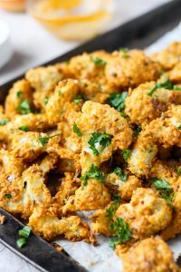 Crispy cauliflower on a baking sheet.