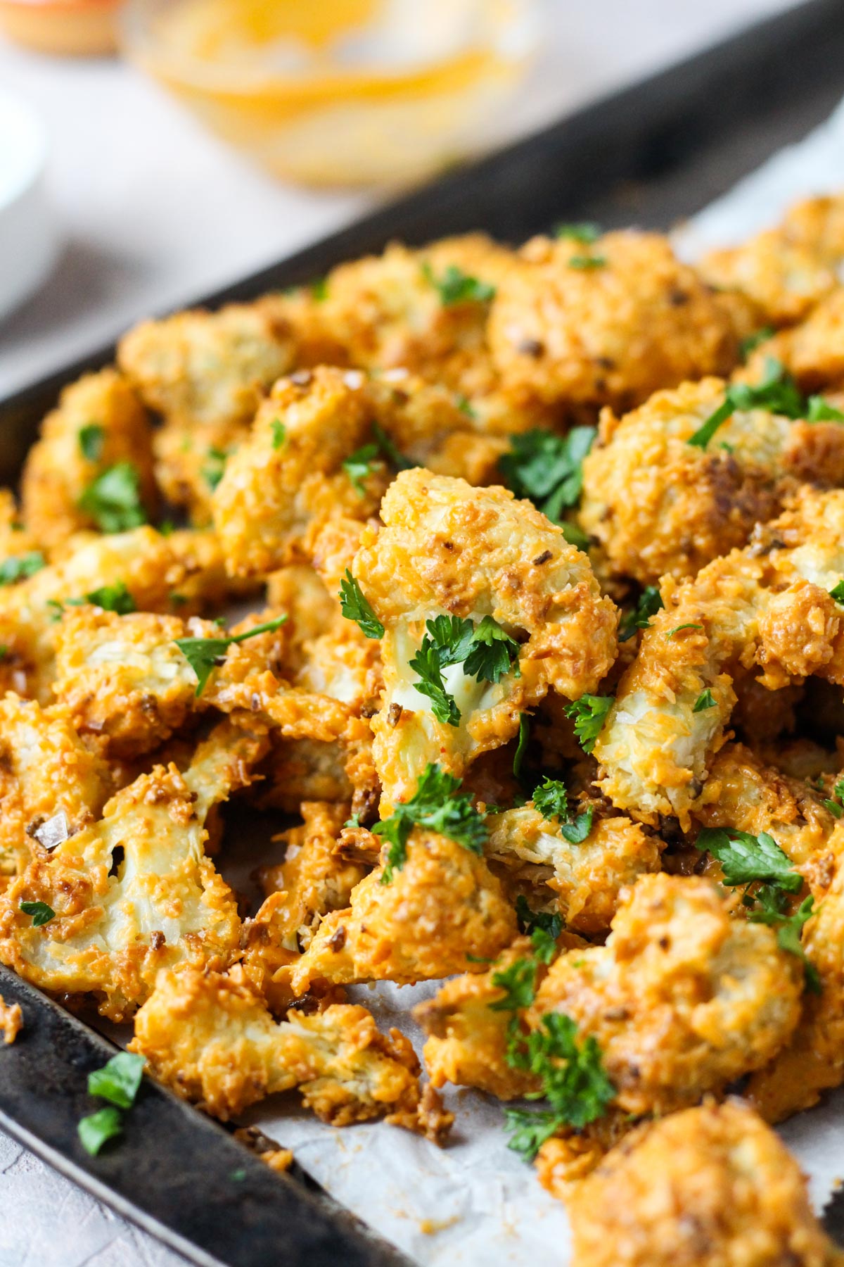 Crispy cauliflower on a baking sheet.