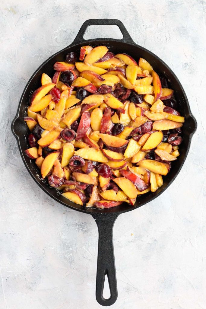 Fruit mixture in cast iron skillet.