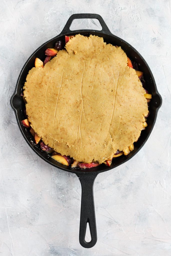 Fruit mixture covered with dough.