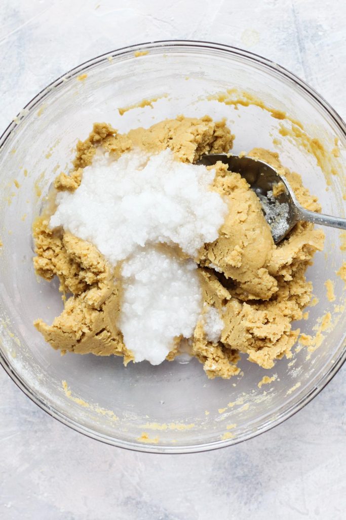 Softened coconut oil poured over dough.