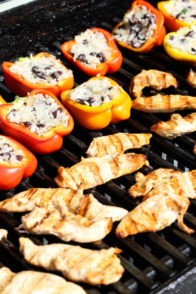Peppers and chicken on grill.