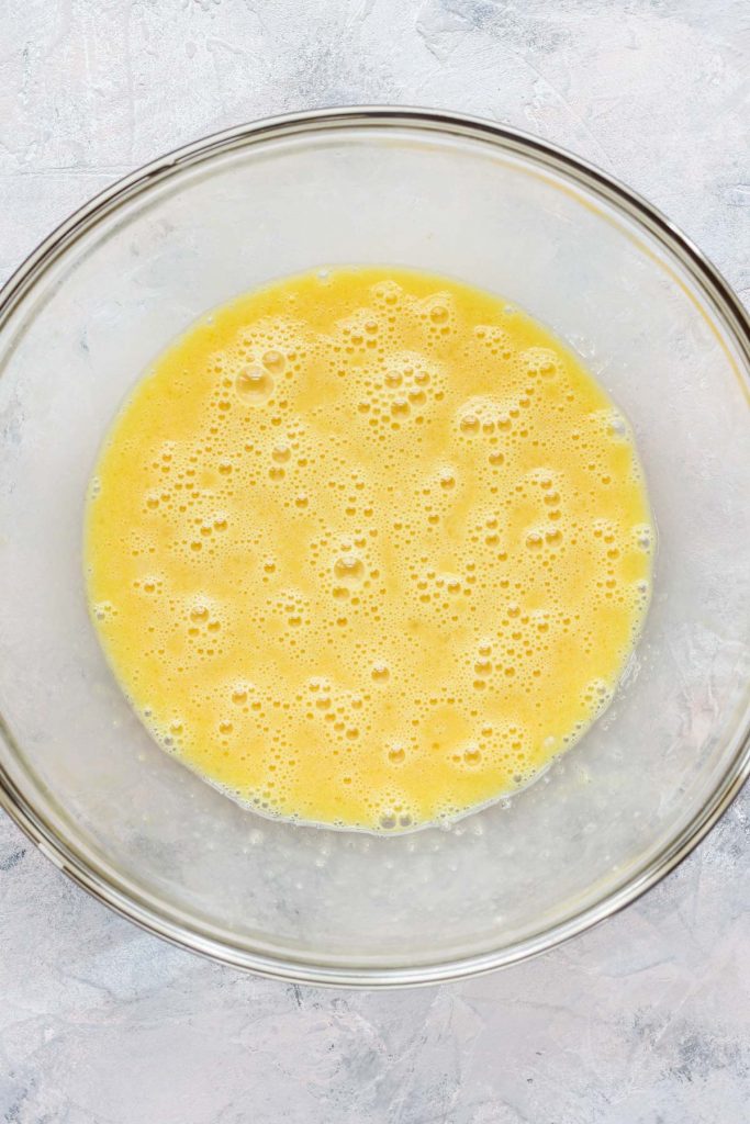 Wet ingredients in glass mixing bowl.