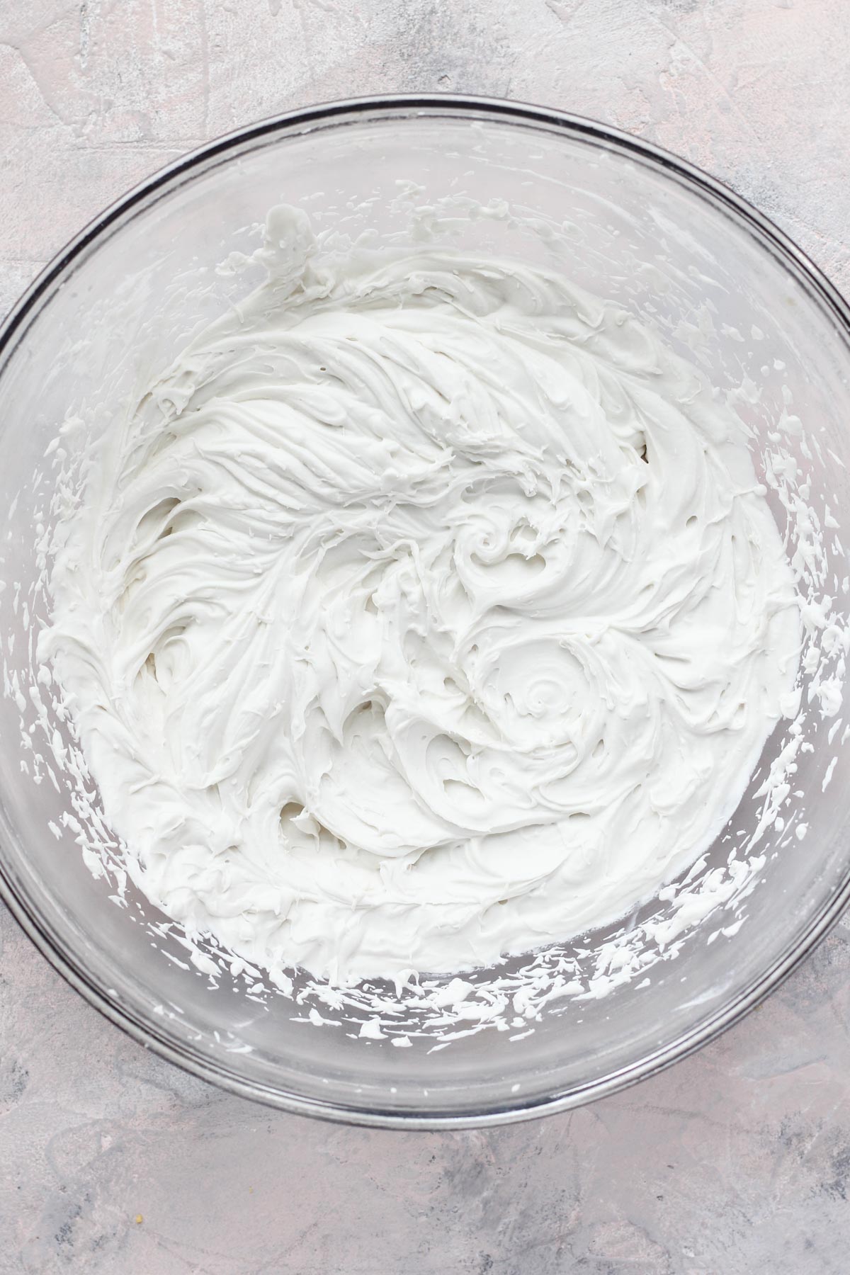 Mixing bowl filled with whipped cream.
