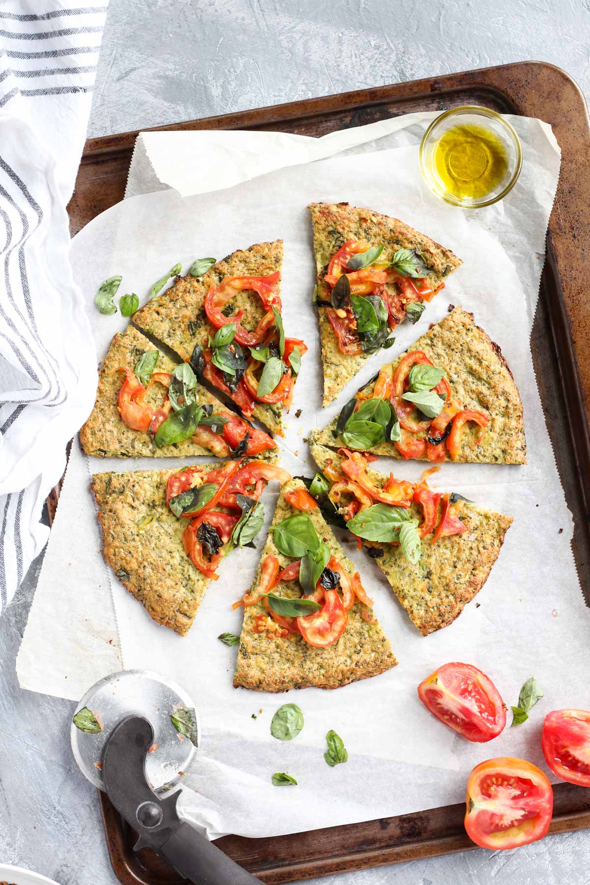Overhead shot of pizza slices on parchment paper.