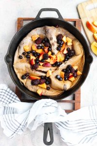 Overhead shot of the dutch baby in a cast iron skillet.