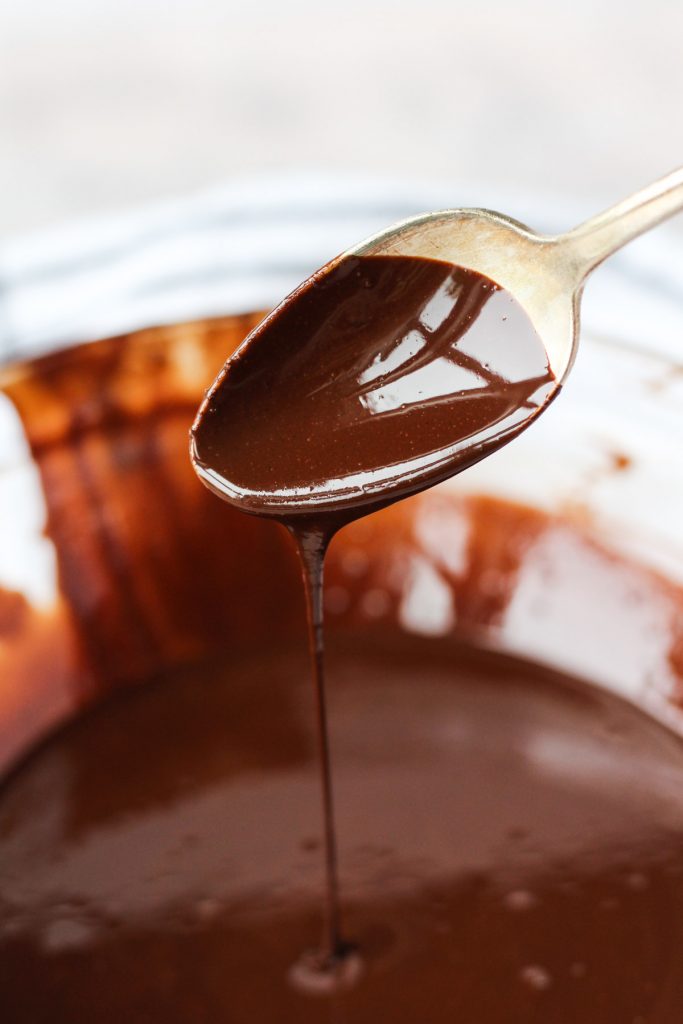 Spoon with chocolate dripping off.