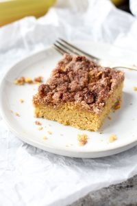 Slice of coffee cake on a white plate.