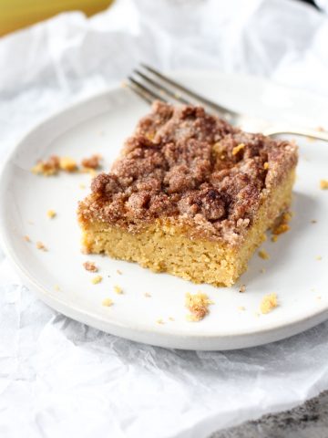 Slice of coffee cake on a white plate.
