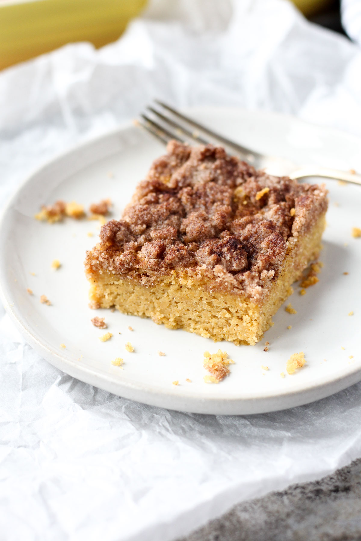 Slice of coffee cake on a white plate.