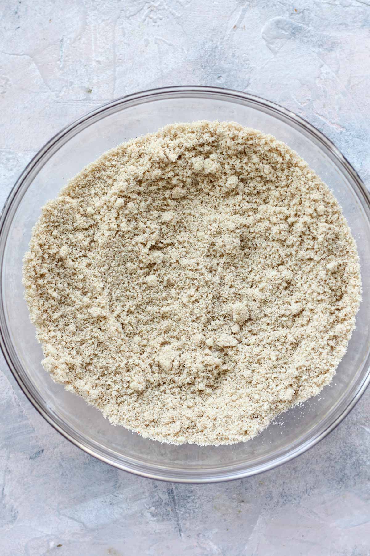Dry ingredients in a glass mixing bowl.