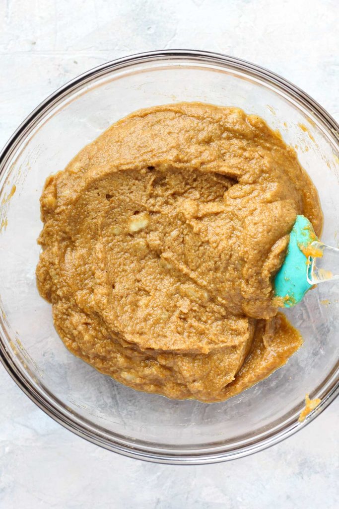 Overhead shot of bread batter in a glass bowl.